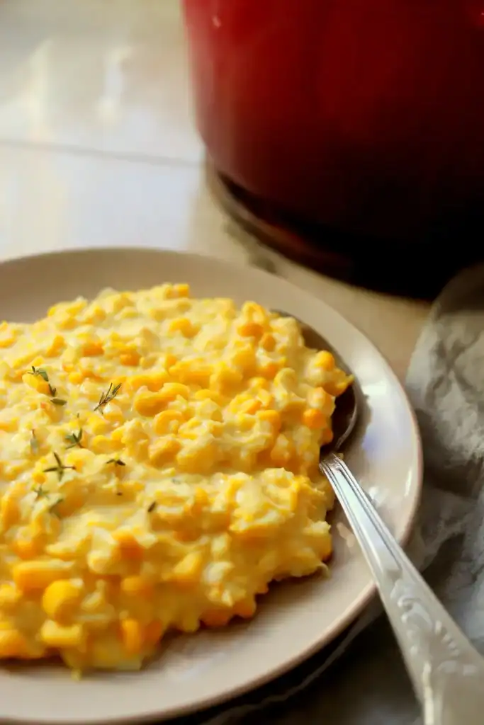 Close-up of rich, buttery creamed corn that was simmered in a Dutch oven.
