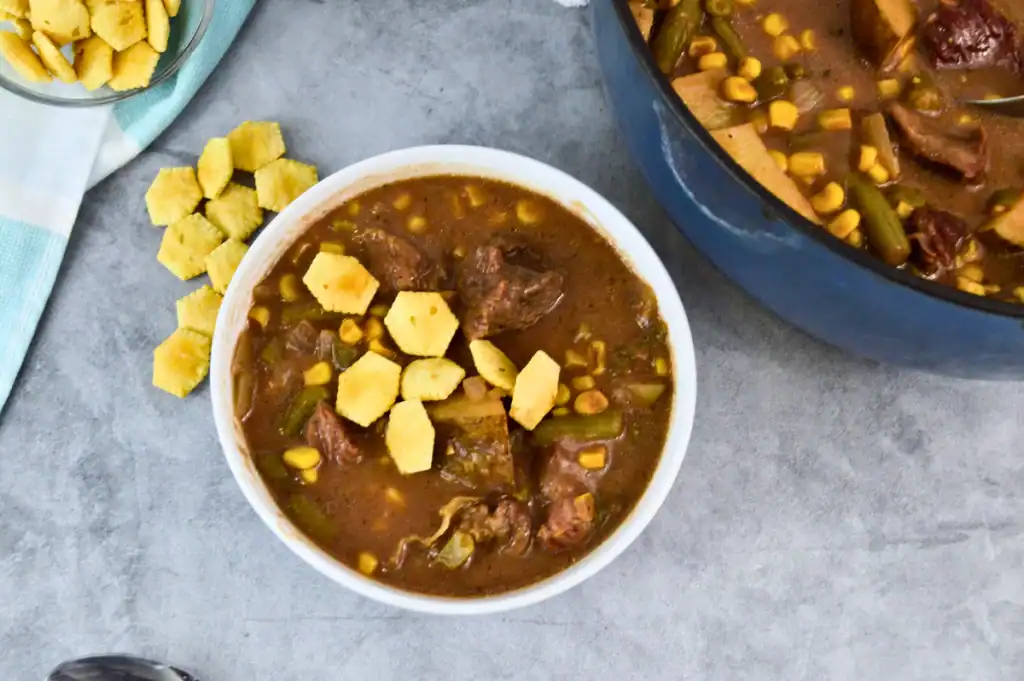 One pot smoked beef stew in a Dutch oven with a deep, flavorful gravy.